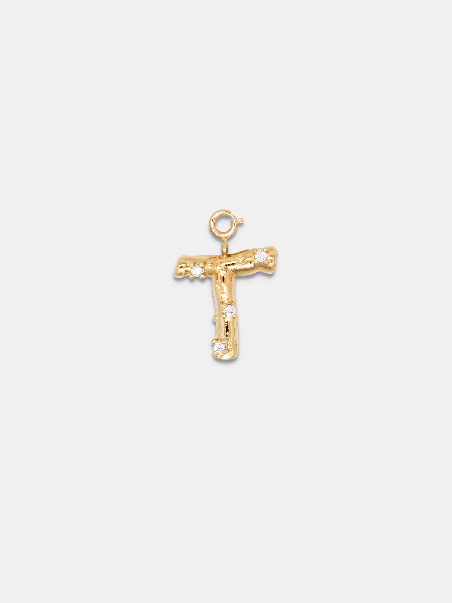 T (gold)